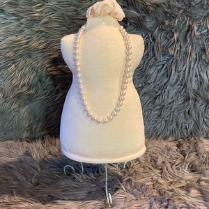 Long faux pearl necklace